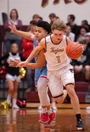 Webster County's Aaron Harmon (1) edges Union County's  Keishon Martin (11) as he heads up court during their Sixth District Tournament game at Webster County High School Monday night, Feb. 24, 2020.