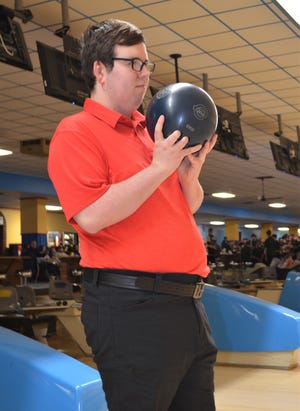 Caden LaTour, a special needs athlete in the special education program at Marshall, bowls with the Redhawks high school bowling team during a junior varsity tournament at M66 Bowl.