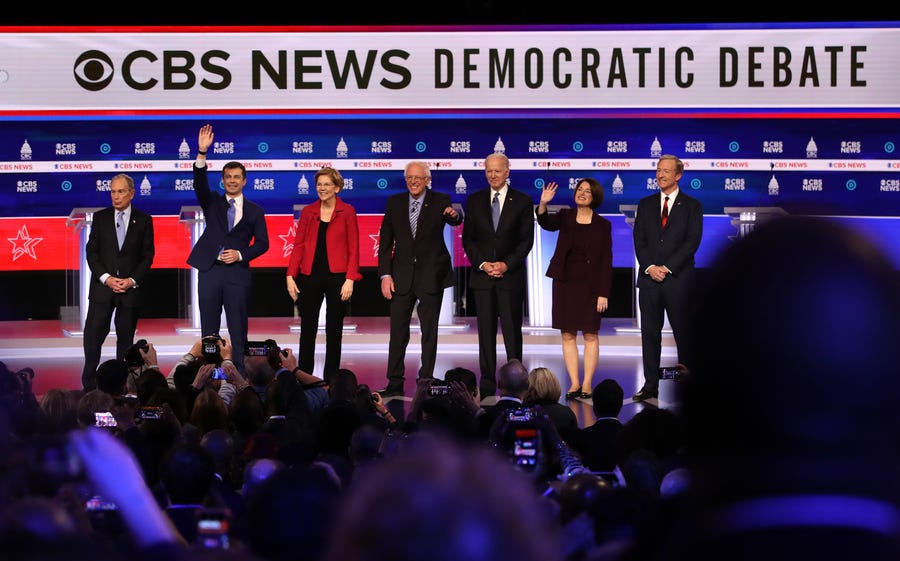 Democratic presidential candidates (L-R) former New York City Mayor Mike Bloomberg, former South Bend, Indiana Mayor Pete Buttigieg, Sen. Elizabeth Warren (D-MA), Sen. Bernie Sanders (I-VT), former Vice President Joe Biden, Sen. Amy Klobuchar (D-MN), and Tom Steyer walk on stage prior to the Democratic presidential primary debate at the Charleston Gaillard Center on Feb. 25, 2020 in Charleston, S. C.. Seven candidates qualified for the debate, hosted by CBS News and Congressional   Black Caucus Institute, ahead of South Carolinas primary in 4 days.