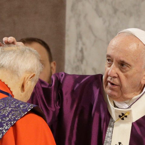 Pope Francis puts ashes on the forehead of Cardina