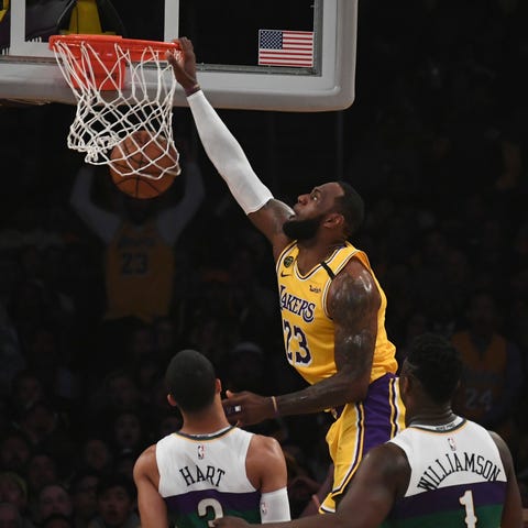 LeBron James dunks the ball during the first half 