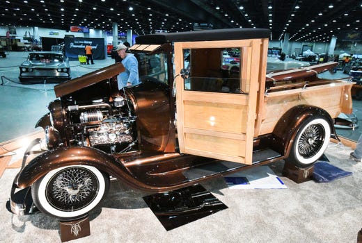 Greg Wilson of Louisville, Kentucky and his beautifully customized 1929 Ford pickup truck with added woodwork and a 1949 flathead motor.