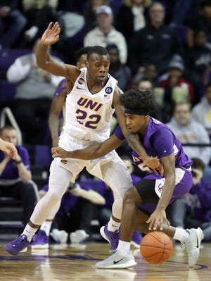 Northern Iowa's Antwan Kimmons guards Evansville's Shamar Givance during action at the McLeod Center in Cedar Falls, Iowa, Wednesday, Feb. 26, 2020.