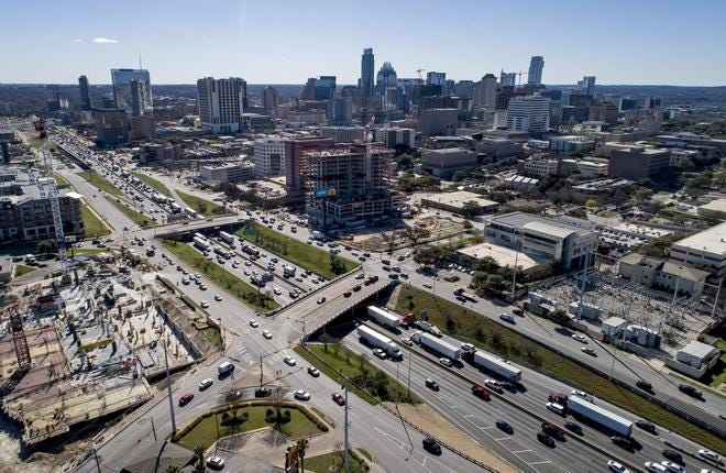 Traffic filters through downtown Austin along Interstate 35 in downtown Austin on Wednesday. The highway is poised to secure full funding for a major overhaul in Austin.