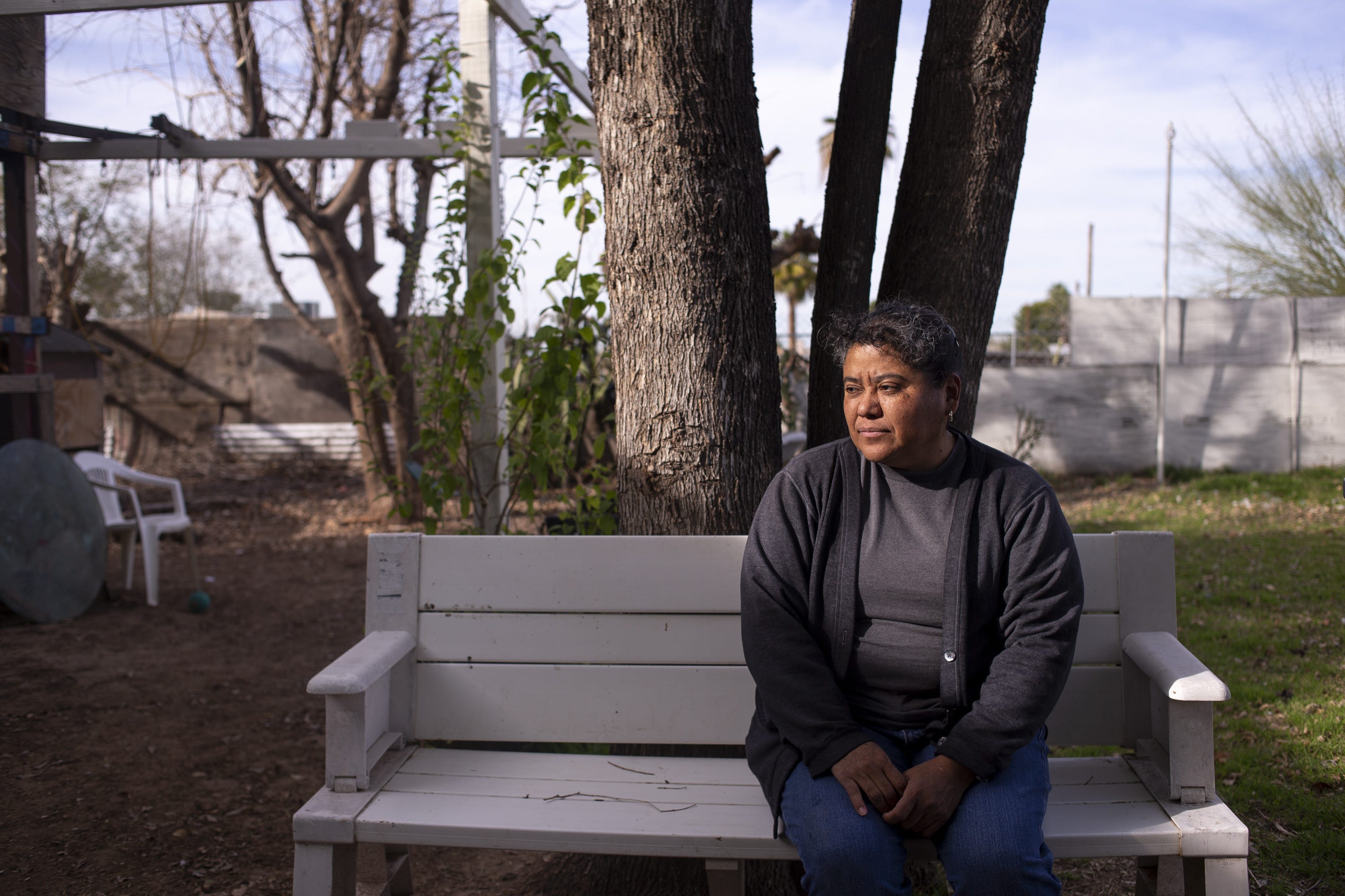 Blanca Abarca in her backyard, where the family stays in the shade to escape the heat during summer months.