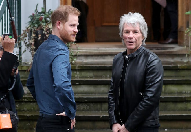 Prince Harry and Jon Bon Jovi arrive to meet members of the Invictus Games Choir at Abbey Road Studios on February 28, 2020 in London.
