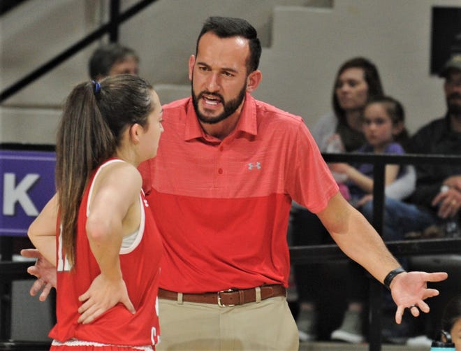 Hermleigh coach Duane Hopper talks to Ryleigh Benitez during the Lady Cards' game against Blackwell in the Region II-1A semifinals in 2020 at ACU's Moody Coliseum.
