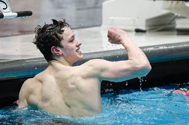 Delta swimmer Braden Samuels looks at his time and celebrates during the IHSAA Boys Swimming and Diving State Championship Meet at the IU Natatorium at IUPUI, Indianapolis, Friday, Feb. 28, 2020. Swimmers that advanced from trials will compete in the finals Saturday, Feb., 29, 2020.