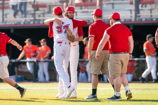 UL pitcher Brandon Young (facing camera), a 2020 MLB Draft prospect, is congratulated after beating Sam Houston State 1-0 in a complete game last February.