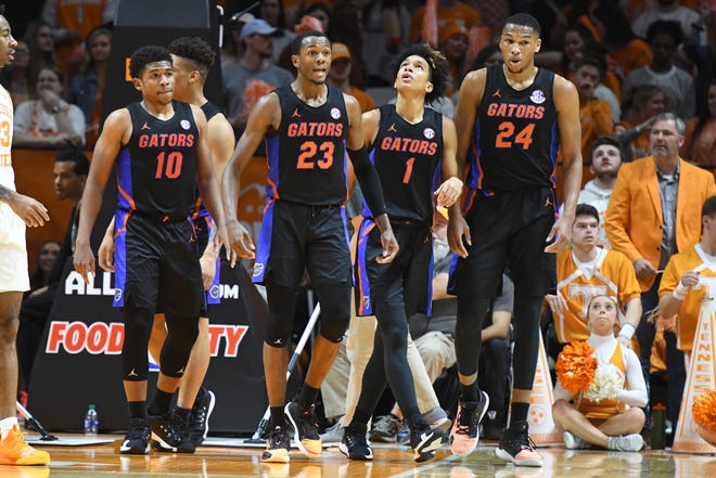 Florida Gators guard Noah Locke (10) and guard Scottie Lewis (23) and guard Tre Mann (1) and forward Kerry Blackshear Jr. (24) during the second half against the Tennessee Volunteers at Thompson-Boling Arena.