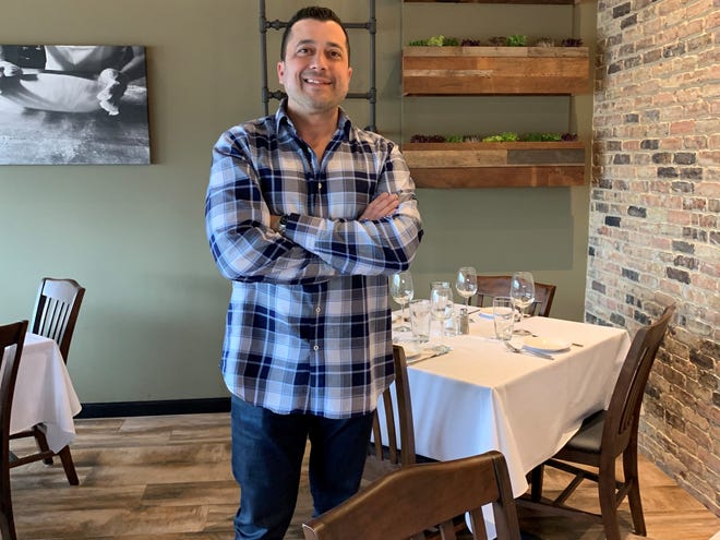 Chef/owner Jim Marino stands in the dining room of his new Bistro di Marino restaurant in Washington Township.