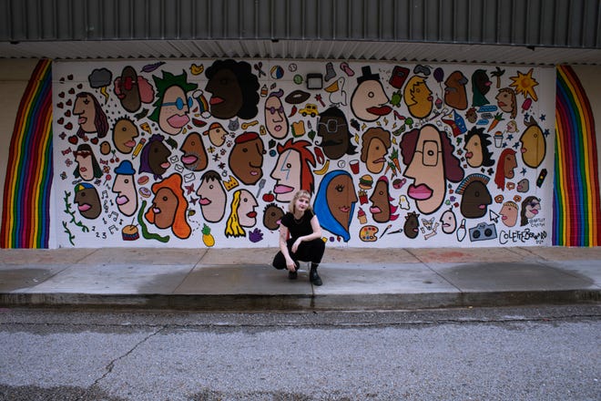 Lafayette native Colette Bernard saw a blank wall on the Children's Museum of Acadiana and wanted to create an inclusive mural. She came up with an I-Spy art piece, one with faces from her sketch book of people watching in New York City, where she goes to school.