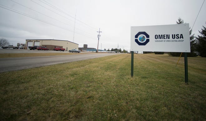 A sign for Omen USA is seen along Rich Road in Richmond.