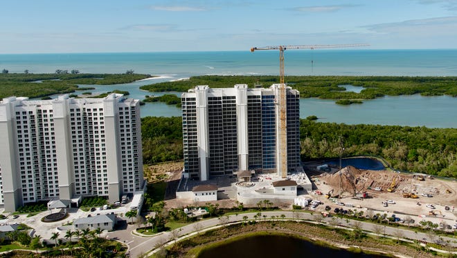 With Tower 200 at Kalea Bay (center) approaching sell out, construction has started on the high-rise community’s third tower (right).