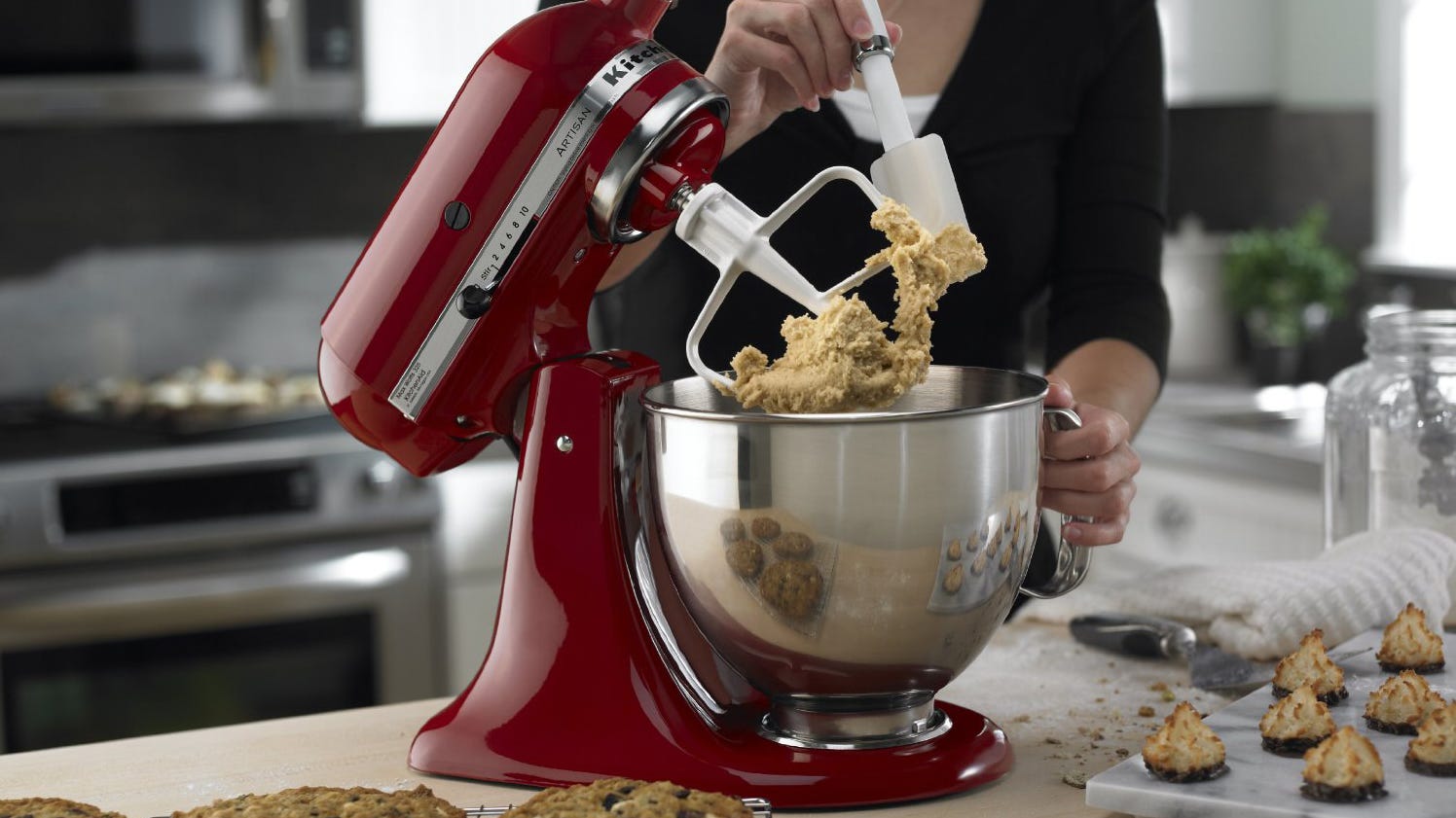 A woman using kitchenaid mixers price