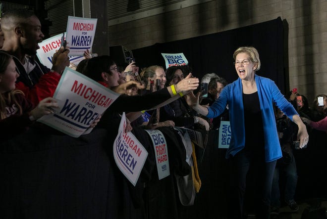 Democratic presidential candidate Senator Elizabeth Warren greets the crowd in Hangar 5 at the Eastern Market in Detroit on Tuesday, March 3, 2020.