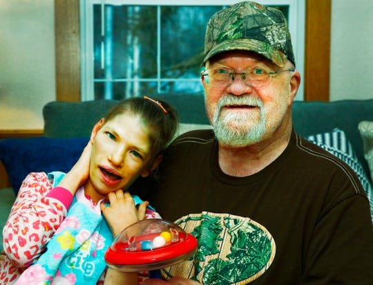 Megan Hess sits with neighbor Toby McClure. Noelle Bye, Times-Gazette.com