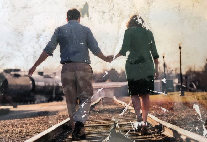 This torn photo of Joshua and Erin Kimberlin was found by Erin's brother after being projected miles from the house destroyed by the tornado that struck Putnam County. The Kimberlins and their young son were killed in the tornado.