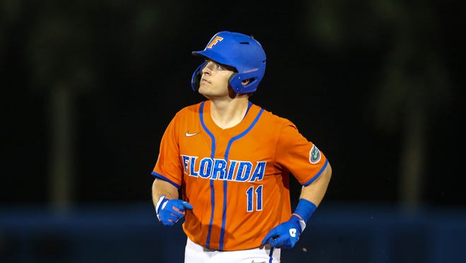 Florida's Nathan Hickey hit a grand slam Saturday to help the Gators roll.