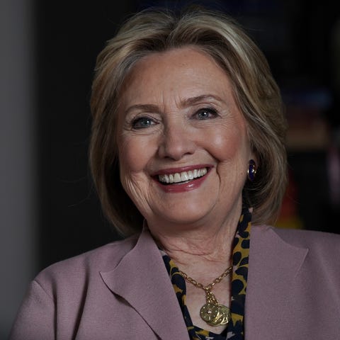 Former Secretary of State Hillary Clinton laughs a