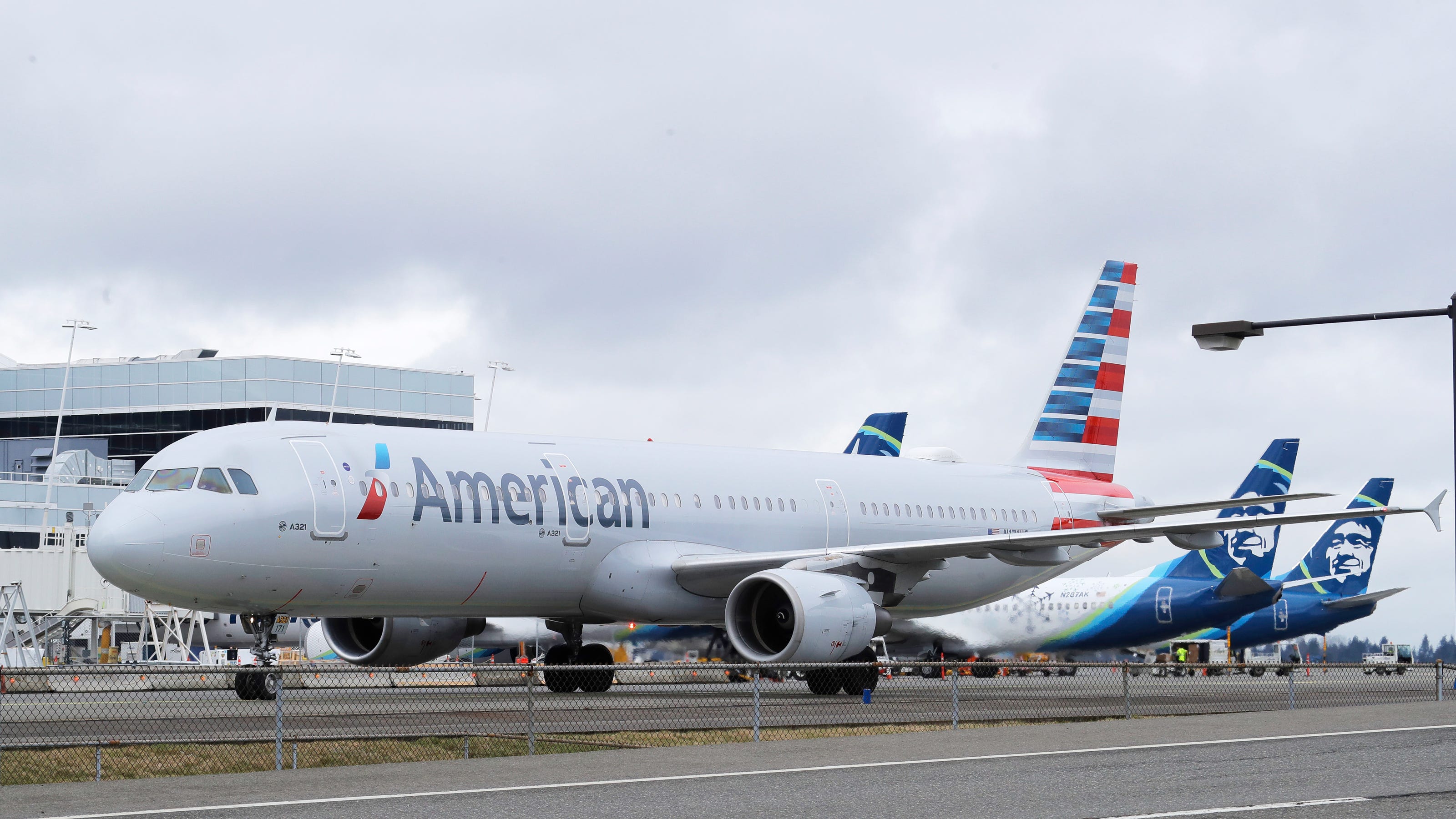American Airlines passenger tries to open exit door; flight diverted