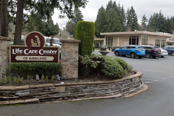 A sign at the entrance to the Life Care Center is shown in Kirkland, Washington, near Seattle, on Tuesday, March 3, 2020. Dozens of people associated with the facility are reported to have respiratory symptoms or be hospitalized and tested for COVID - 19 coronavirus.