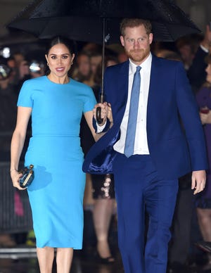 Duchess Meghan was elegant in a baby blue pencil dress when she arrived with Prince Harry at the Endeavor Fund Awards at Mansion House in London on March 5, 2020.