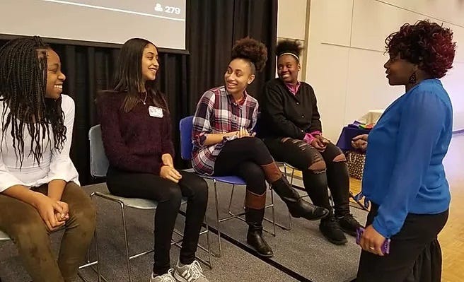 Students attend the 2018 "Many Shades Of Colour" young women's conference at Drake University.