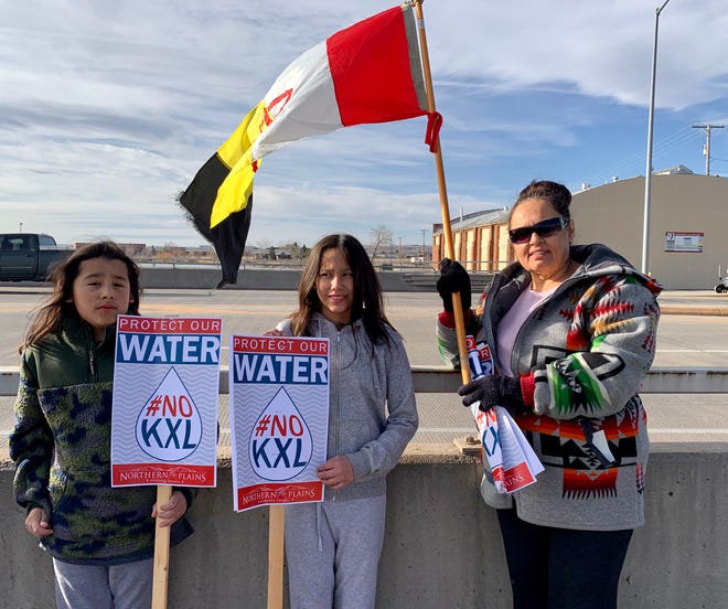Debbie McShane, president of the American Indian Movement for the state of Montana, brought her two children, Sky Running Enemy, 10 (left) and Kendalyn Running Enemy, 11 (middle), to protest the Keystone XL Pipeline in Great Falls.