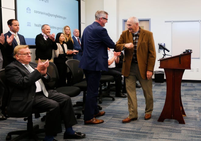 Springfield-Greene County Health Department Director Clay Goddard and County Commissioner Harold Bengsch bump elbows as an alternative to shaking hands at a press conference about the coronavirus on Friday, March 6, 2020.