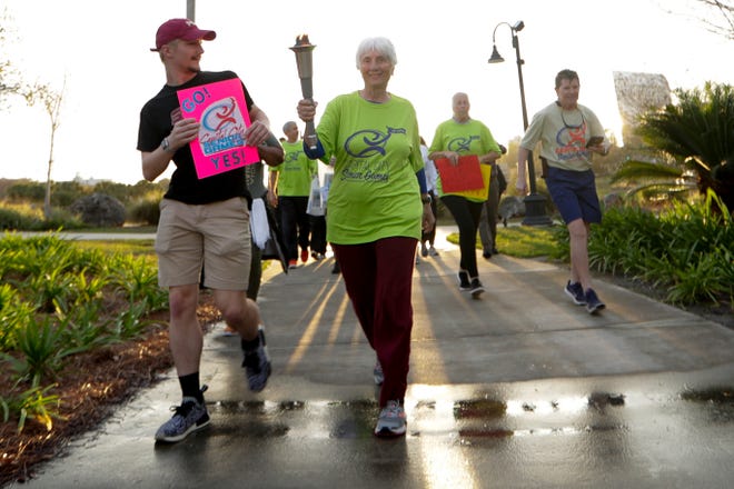 Joel Dawson, representing pickleball, leads the way during the torch run that kicked off the 11th annual Capital City Senior Games at Cascades Park on March 5, 2020. Athletes and fans can help kick off the Capital City Senior Games this year by viewing the virtual Torch Run, which will debut on April 30.