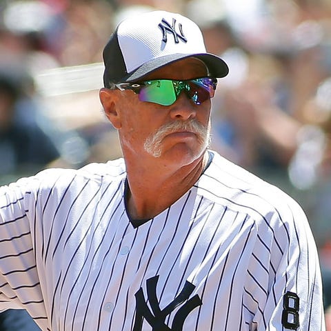 Former Yankees pitcher Rich "Goose" Gossage waves 