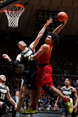 Rutgers Scarlet Knights guard Ron Harper Jr. (24) rides for a dunk against Purdue Boilermakers center Matt Haarms (32) during the first half at Mackey Arena.
