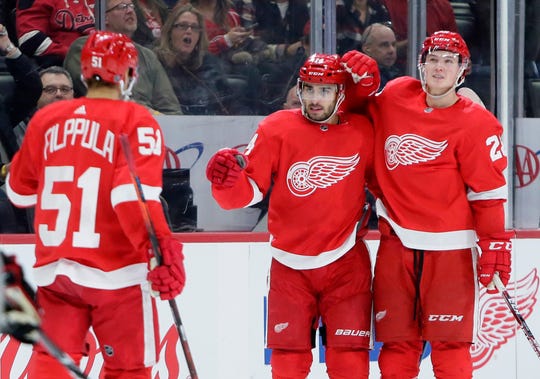 Detroit Red Wings center Robby Fabbri, center, celebrates his second-period goal against the Chicago Blackhawks with center Valtteri Filppula (51) and defenseman Gustav Lindstrom.