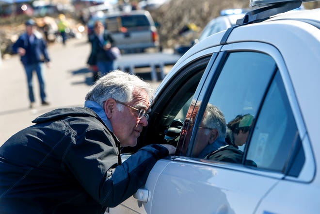 Nashville Mayor John Cooper draws on a subway police officer to thank them for their work on the Donford Stanford Estates subdivision in Nashville, Tennessee, on Saturday March 7, 2020.