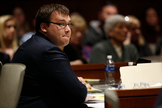 Defendant John Austin Hopkins looks toward the jury box during the State's opening statements  preceding his trial at the Warren County Common Pleas Court in Lebanon, Ohio, on Monday, March 9, 2020. Hopkins, a former gym teacher, was indicted by a Warren County grand jury June 17, 2019 on 36 counts of gross sexual imposition involving 28 girls at Clearcreek Elementary School. 