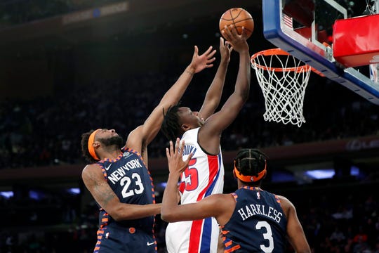 New York Knicks center Mitchell Robinson (23) defends Detroit Pistons forward Sekou Doumbouya (45) during the first half.