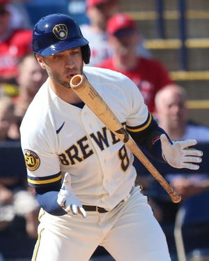 Ryan Braun checks his swing during the fourth inning of their spring training game against the Angels on Sunday in Phoenix.