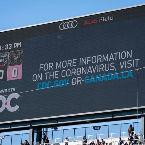 The scoreboard displays a message regarding corona