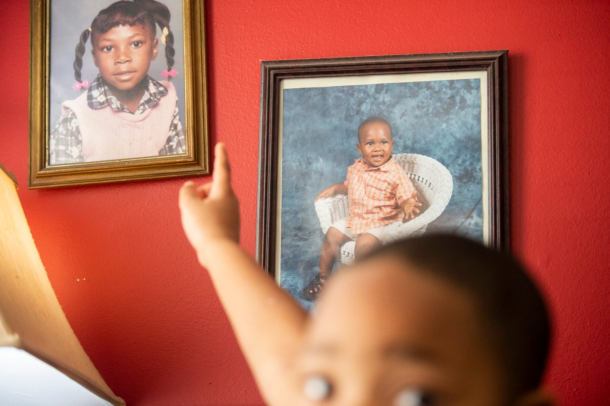 A young picture of Chauncey Blackburn hangs at his family's home in Montgomery, Ala., on Sunday, March 8, 2020. Chauncey Blackburn, 18, was shot and killed Feb. 24, 2018, no one has been charged with his murder.