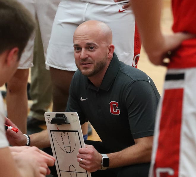 Canton basketball coach Jimmy Reddy talks during a timeout against Detroit Catholic Central on March 9, 2019.