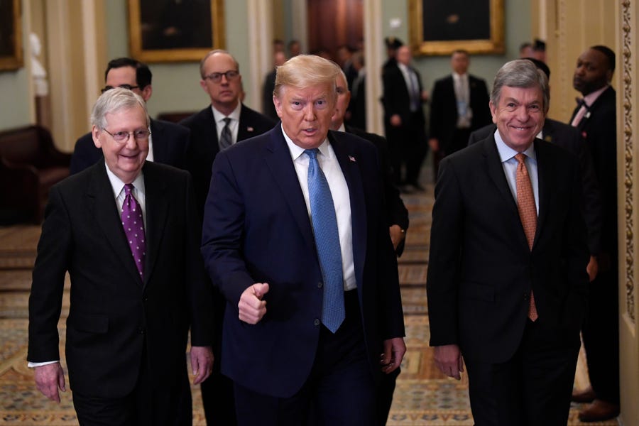 President Donald Trump, center, walks with Senate Majority Leader Mitch McConnell of Ky., left, and Sen. Roy Blunt, R-Mo., right, on Capitol Hill in Washington, Tuesday, March 10, 2020.