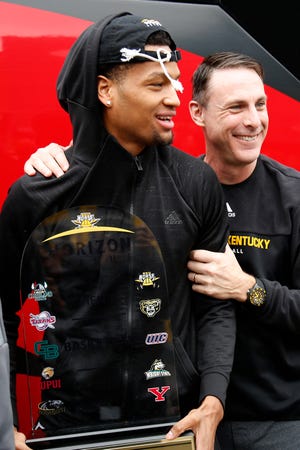 Head coach Darrin Horn hugs senior Dantez Walton outside the student union building at Northern Kentucky University in Highland Heights, Ky., on Wednesday, March 11, 2020. Fan celebrated the return to campus of the men's basketball team following its Tuesday night Horizon League Tournament Championship win in Indianapolis. The Norse now advance to their Div-1 NCAA Tournament berth. 