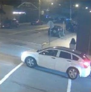 Police are searching for a white Dodge Caliber in connection to a March 3 shooting.