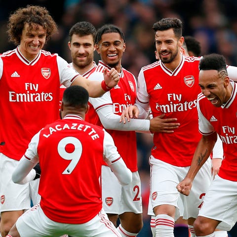 Arsenal striker Alexandre Lacazette celebrates wit