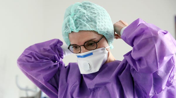Doctor in Gross Gerau, Germany, prepares to test a