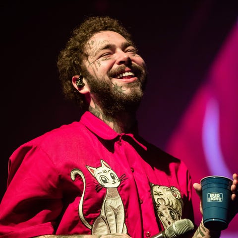 Post Malone performs onstage during his "Runaway" 