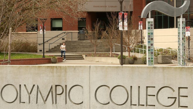 FILE ⁠— A student hurries through the empty courtyard at Olympic College in Bremerton in March 2020. Enrollment at the college has declined since the pandemic, and the school's child care center, the Sophia Bremer Early Learning Academy, which closed for a period, has struggled to hire workers for the center.
