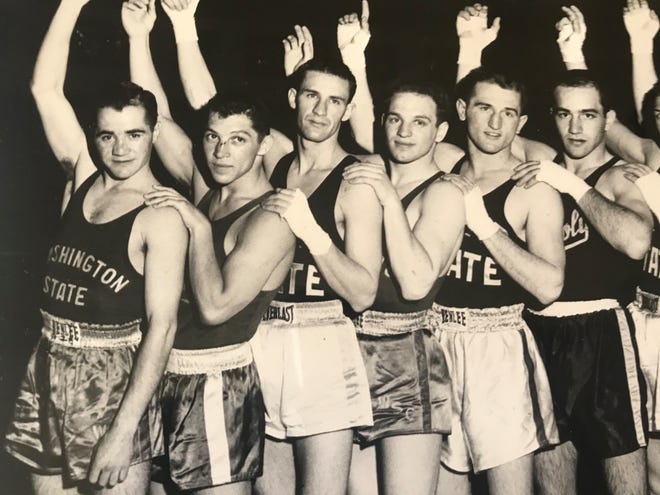Sam Macias, second from left, is shown after winning at the Pacific Coast Intercollegiate Boxing champions in Memorial Stadium in Sacramento in 1956.