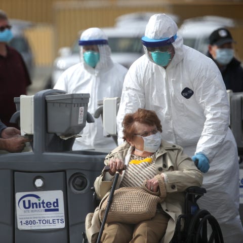 A medical worker assists a passenger from the Prin